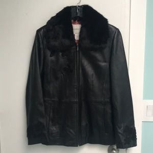 Leather jacket with detachable rabbit fur collar.